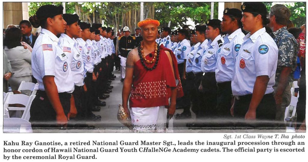 Kahu Ray Ganotise, a retired National Guard Master Sgt., leads the inaugural procession through an honor cordon of Hawaii National Guard Youth CHalleNGe Academy cadets. The official party is escorted by the ceremonial Royal Guard.