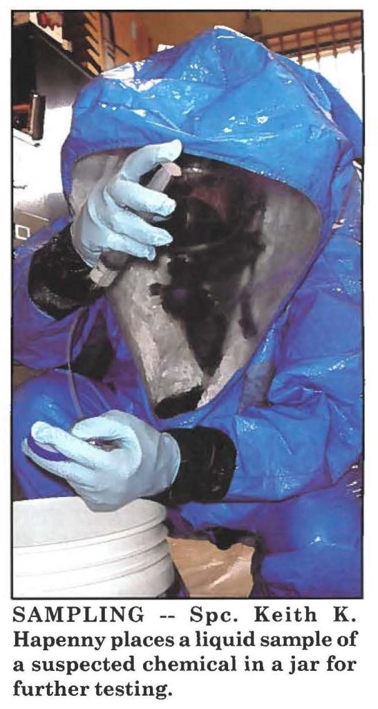 SAMPLING -- Spc. Keith K. Hapenny places a liquid sample of a suspected chemical in a jar for further testing.