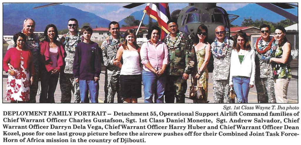 DEPLOYMENT FAMILY PORTRAIT- Detachment 55, Operational Support Airlift Command families of Chief Warrant Officer Charles Gustafson, Sgt. 1st Class Daniel Monette, Sgt. Andrew Salvador, Chief Warrant Officer Darryn Dela Vega, ChiefWarrant Officer Harry Huber and ChiefWarrant Officer Dean Kozel, pose for one last group picture before the aircrew pushes off for their Combined Joint Task ForceHorn of Africa mission in the country of Djibouti.