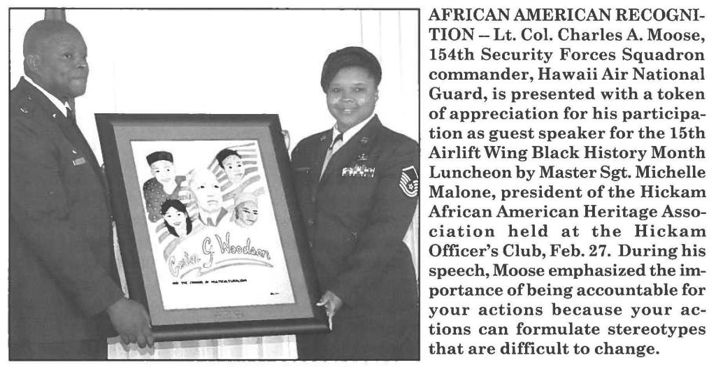 AFRICAN AMERICAN RECOGNITION - Lt. Col. Charles A. Moose, 154th Security Forces Squadron commander, Hawaii Air National Guard, is presented with a token of appreciation for his participation as guest speaker for the 15th Airlift Wing Black History Month Luncheon by Master Sgt. Michelle Malone, president of the Hickam African American Heritage Association held at the Hickam Officer's Club, Feb. 27. During his speech, Moose emphasized the importance of being accountable for your actions because your actions can formulate stereotypes that are difficult to change.