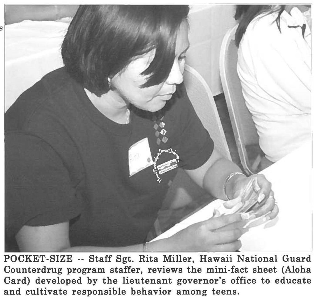 POCKET-SIZE -- Staff Sgt. Rita Miller, Hawaii National Guard Counterdrug program staffer, reviews the mini-fact sheet (Aloha Card) developed by the lieutenant governor's office to educate and cultivate responsible behavior among teens.