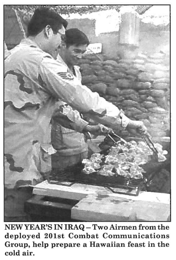 NEW YEAR'S IN IRAQ-Two Airmen from the deployed 201st Combat Communications Group, help prepare a Hawaiian feast in the cold air.