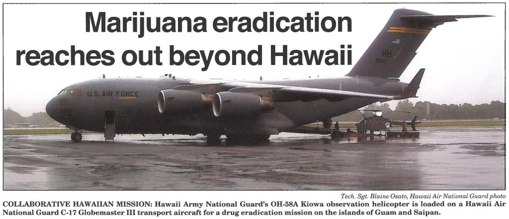 COLLABORATIVE HAWAIIAN MISSION: Hawaii Army National Guard's OH-58A Kiowa observation helicopter is loaded on a Hawaii Air National Guard C-17 Globemaster III transport aircraft for a drug eradication mission on the islands of Guam and Saipan.