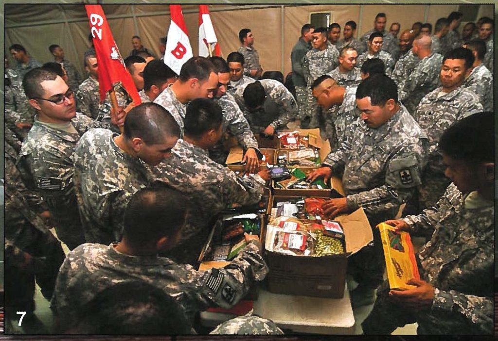 Maj. Gen. Robert G.F. Lee, the adjutant general and Command Chief Master Sgt. Denice M. Jelinski-Hall visit the troops during the holidays, bringing Operation GIFT LIFT goodies.