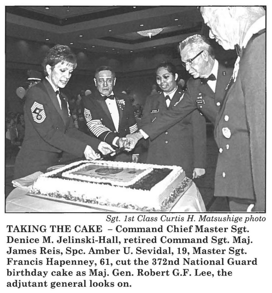 TAKING THE CAKE - Command Chief Master Sgt. Denice M. Jelinski-Hall, retired Command Sgt. Maj. James Reis, Spc. Amber U. Sevidal, 19, Master Sgt. Francis Hapenney, 61, cut the 372nd National Guard birthday cake as Maj. Gen. Robert G.F. Lee, the adjutant general looks on.
