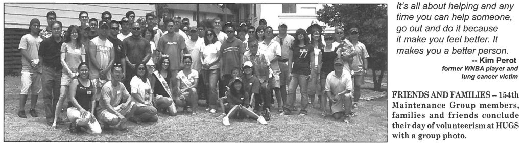 FRIENDS AND FAMILIES-154th Maintenance Group members, families and friends conclude their day of volunteerism at HUGS with a group photo.
