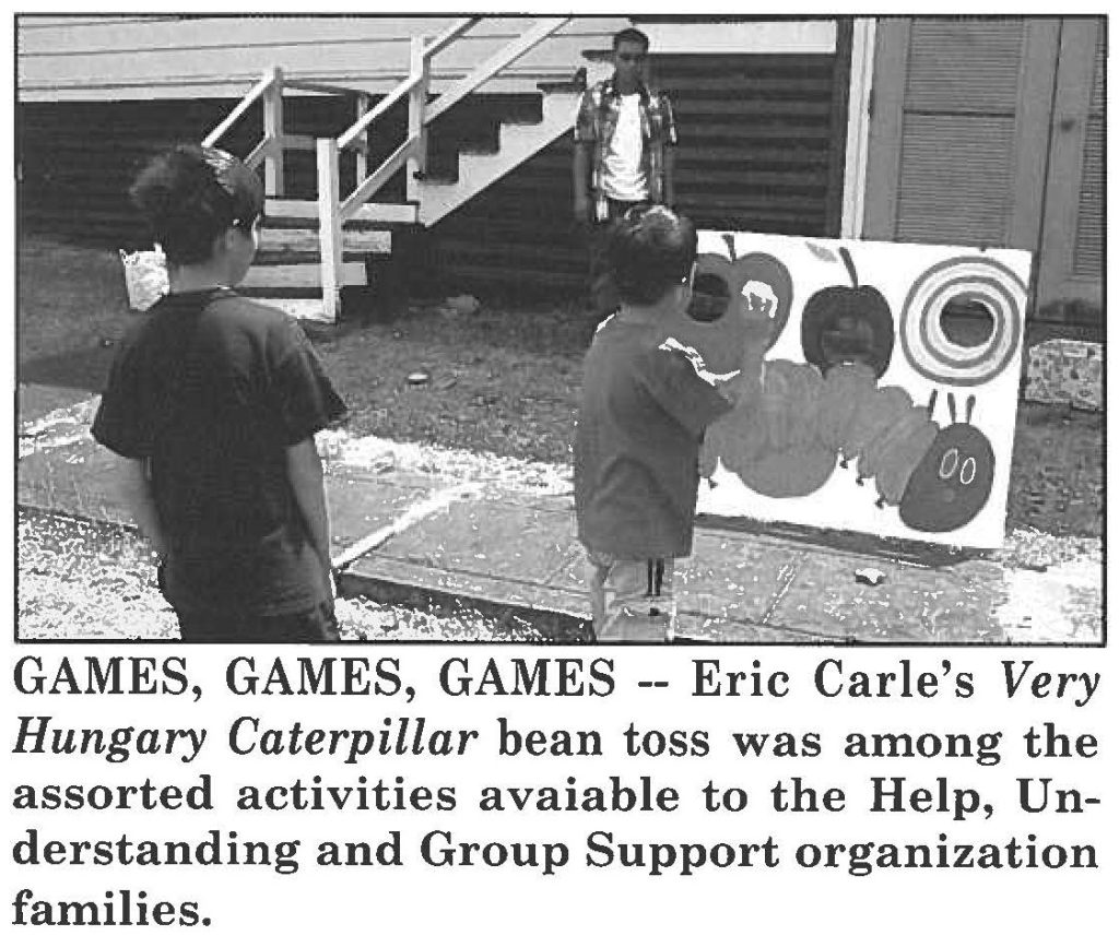 GAMES, GAMES, GAMES -- Eric Carie's Very Hungary Caterpillar bean toss was among the assorted activities available to the Help, Understanding and Group Support organization families.