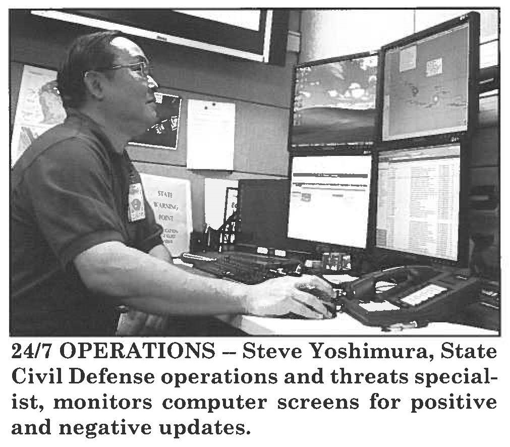 24/7 OPERATIONS - Steve Yoshimura, State Civil Defense operations and threats specialist, monitors computer screens for positive and negative updates.