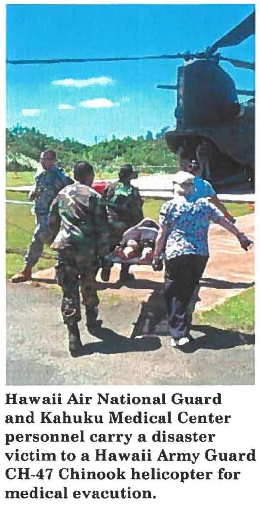 Hawaii Air National Guard and Kahuku Medical Center personnel carry a disaster victim to a Hawaii Army Guard CH-47 Chinook helicopter for medical evacuation.