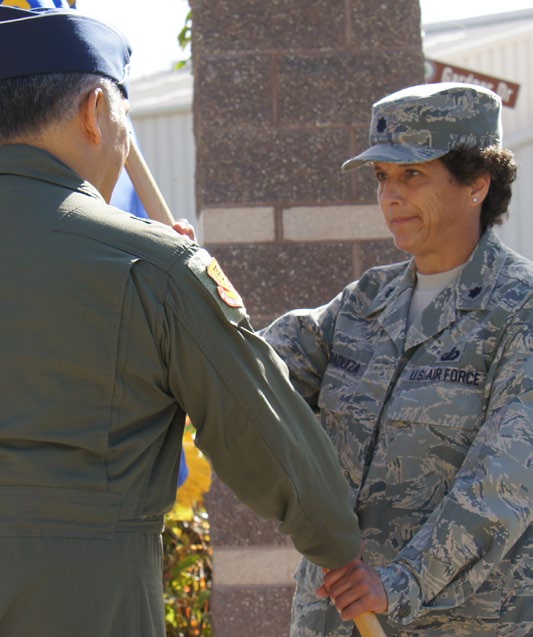 Lt. Col. Robin Tibaduiza receives command of the 154th Wing Comptroller Flight from Brig. Gen. Braden Sakai, Commander 154th Wing, during the change of command ceremony, April 11, 2015, Joint Base Pearl Harbor-Hickam (Air National Guard Photo by TSgt. Andrew Lee Jackson)
