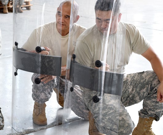 Members of the Quick Reaction Force for the Hawaii Army National Guard practice riot shield techniques June 26, 2015, at Kalaeloa, Hawaii. (U.S. Army National Guard photo by Staff Sgt. Ryan Sheldon/Released)