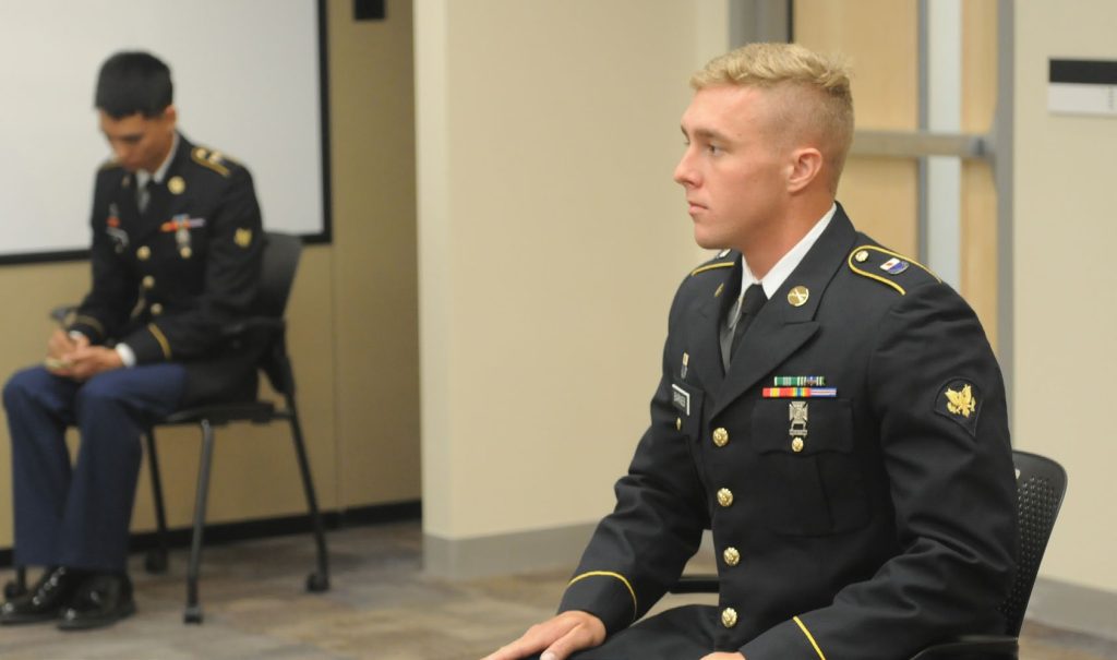 Soldiers stand in front of a board of Command Sergeant Majors in the final event of the National Best Warrior Competition held on Camp Williams June 25, 2015.