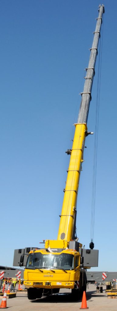 The specially designed crane prepares to offload shipping containers at Joint Base Pearl Harbor Hickam in Hawaii on June 5, 2105 as a part of the Vigilant Guard/Makani Pahili 2015 exercise. The mobile crane was procured in 2014, and is an integral part of APC. (U.S. Army National Guard photo by Pfc. Paul D. Berzinas/Released)