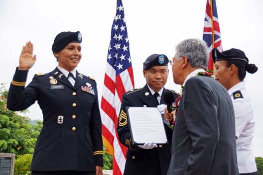 I SWEAR TO . . . -- Maj. Tulsi Gabbard is given the oath of office by former U. S. Sen. Daniel K. Akaka, her former boss as a senate legislative aide.