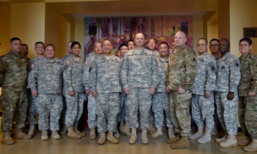 Lt. Gen. Timothy J. Kadavy, director of the Army National Guard, poses with commander of the Hawaii Army National Guard Brig. Gen. Keith Y. Tamashiro and his staff after a tour of the 29th Infantry Brigade Combat Team headquarters in Kalaeloa, Hawaii. Kadavy visited several Hawaii Army National Guard facilities during his visit to the island of Oahu.