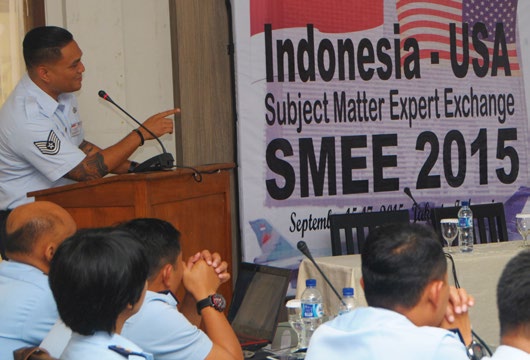 Tech. Sgt. Jacy Lau, an Air Surveillance Technician with the 169th Air Defense Squadron briefs track detection and initiation to members of Kohanudnas, the component of the Indonesian Armed Forces responsible for air defense, Jakarta, Indonesia.