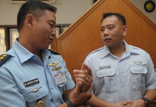 Master Sgt. Joseph Salvador, Hawaii Air National Guard State Partnership Program, speaks with Lt. Col. Satriyo Utomo from Kohanudnas. Kohanudnas is the air defense component of the Indonesian armed forces.