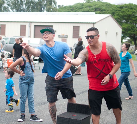 U.S. Air Force airmen and families from the Hawaii Air National Guard 154th Security Forces Squadron participate in the activites of a Family day event on Joint Base Pearl HarborHickam, Hawaii on Aug. 7, 2016. The 154th SFS has one of the highest deployment rates in the HIANG. (U.S. Air National Guard photo by Airman 1st Class Stan Pak/released)