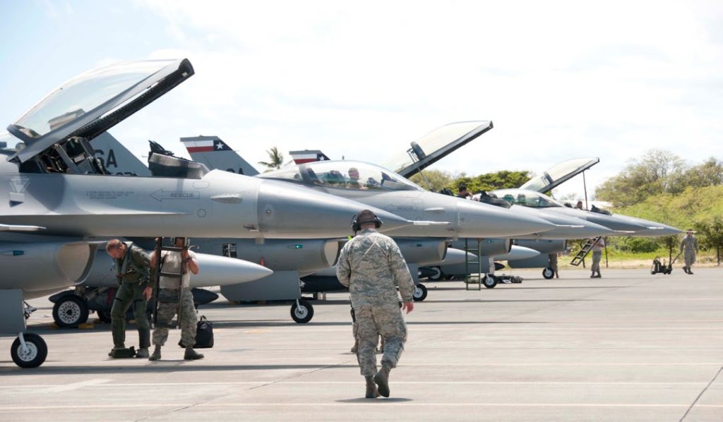 F-16 Fighting Falcons from the Texas Air National Guard’s 149th Fighter Wing line the tarmac at Joint Base Pearl Harbor-Hickam, Hawaii on Aug. 17 2016. The visiting airmen and aircraft are participating in the Hawaii Air National Guard’s Sentry Aloha exercise. Sentry Aloha provides tailored, cost effective and realistic combat training for U.S. Air Force, Air National Guard and other Department of Defense services to provide U.S. warfighters with the skill sets necessary to perform their homeland defense and overseas combat missions. (U.S. Air Force photo by Airman 1st Class Stan Pak/released)