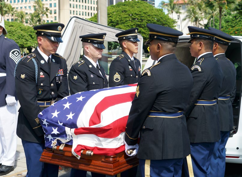 Members of an honor guard from the Hawaii Army National Guard carry the flag-draped coffin of the late U.S. Rep. Mark Takai into the state Capitol in Honolulu, Thursday, Aug. 18, 2016. Friends and family gathered to remember the Hawaii Democrat as a warm public servant who never gave up when facing adversity