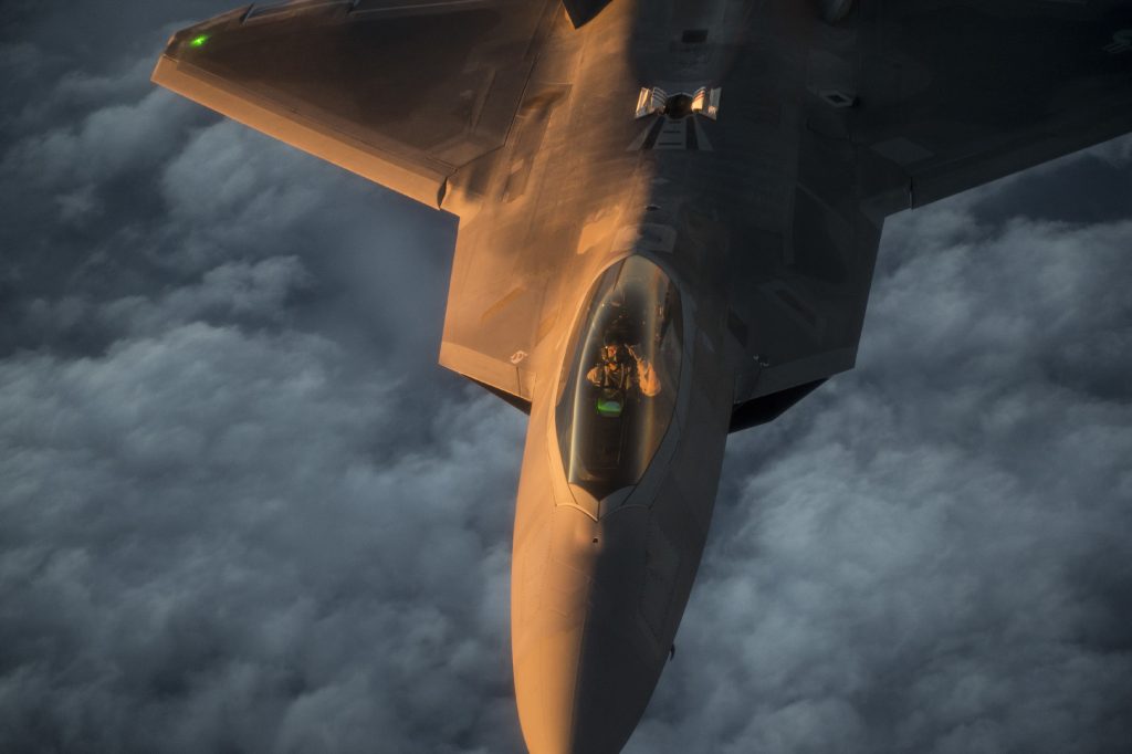 A U.S. Air Force F-22 Raptor flies over the Arabian Sea in support of Operation Inherent Resolve, Jan. 27, 2016. The F-22 is a fifth-generation aircraft and is designed to engage in air-to-air and air-to-ground missions. OIR is the coalition intervention against the Islamic State of Iraq and the Levant. (U.S. Air Force photo by Staff Sgt. Corey Hook/Released)