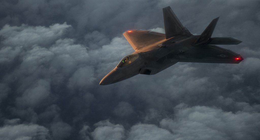 A U.S. Air Force F-22 Raptor flies over the Arabian Sea in support of Operation Inherent Resolve, Jan. 27, 2016. The F-22’s combination of sensor capability, integrated avionics, situational awareness, and weapons provides first-kill opportunity against threats. OIR is the coalition intervention against the Islamic State of Iraq and the Levant. (U.S. Air Force photo by Staff Sgt. Corey Hook/Released)