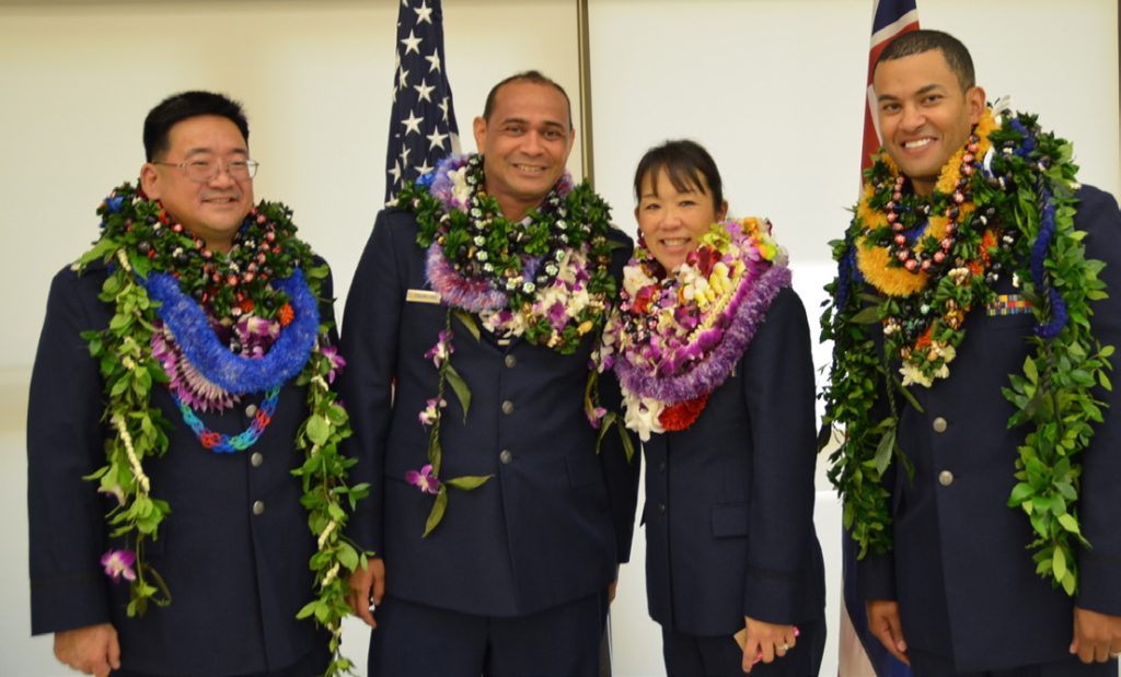 Lt. Col. Ryan Endo, Lt. Col. James Faumina, Lt. Col. Jamie Jicha and Lt. Col. Stuart Thompson from the 154th Medical Group pose together during their joint promotion and pinning ceremony, Jan. 10, 2016, Joint Base Pearl Harbor-Hickam. The officers were given Lei, a tradition in Hawaii for greetings, honor, friendship, and to recognize accomplishment. (Courtesy Photo)