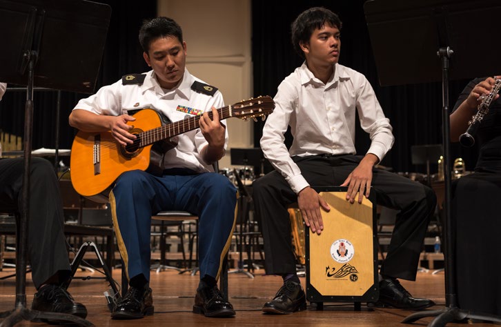 U.S. Army Sgt. 1st Class Patrick Okubo rehearses alongside Raistlin Ramos at the Pearl City Cultural Center in Pearl City, Hawaii on June 12, 2016. Okubo and Ramos were preparing for a performance as part of a community outreach mission put on by the Hawaii Army National Guard’s 111th Army Band. (U.S. Army National Guard photo by Spc. Paul D. Berzinas/Released)