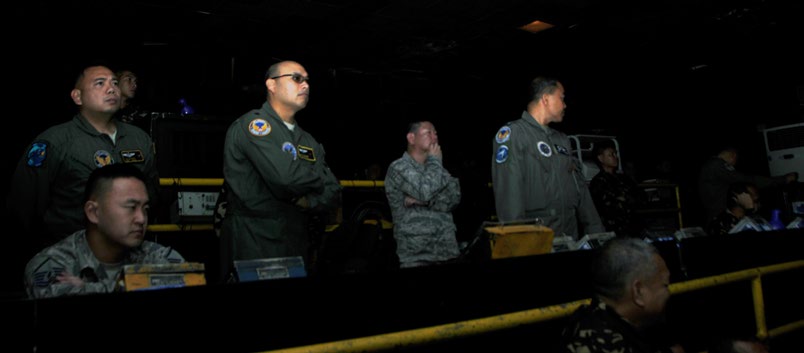 Hawaii Air National Guard Airmen observe a Philippine Air Force air intercept exercise at the control room at Wallace Air Station, Philippines, Aug. 31, 2016. The demonstration was part of a State Partnership Program subject matter expert exchange between the HIANG and PAF. The State Partnership Program is a National Guard program that links a state’s national guard with a partner country to help build capacity and security cooperation.