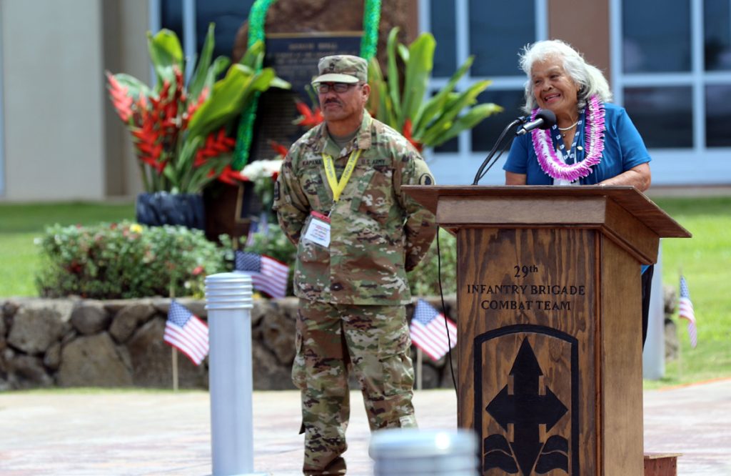 Mrs. Shirley Kauhaihao, widow of 1st Lt. John K. Kauhaihao, delivers remarks during the Hawaii National Guard 50th Vietnam Memorial Cceremony at the 29th Infantry Brigade Combat Team Readiness Center in Kapolei on May 25, 2017. First Lt. John Kauhaihao was posthumously awarded the Distinguished Service Cross for extraordinary heroism and devotion to duty during the Vietnam War and is one of the 29 fallen of the Hawaii Army National Guard Soldiers from that war. First Lt. Kauhaihao is the first name listed on the memorial stone or “pohaku” behind Mrs. Kauhaihao. (U.S. Army photo by Spc. Matthew A. Foster)