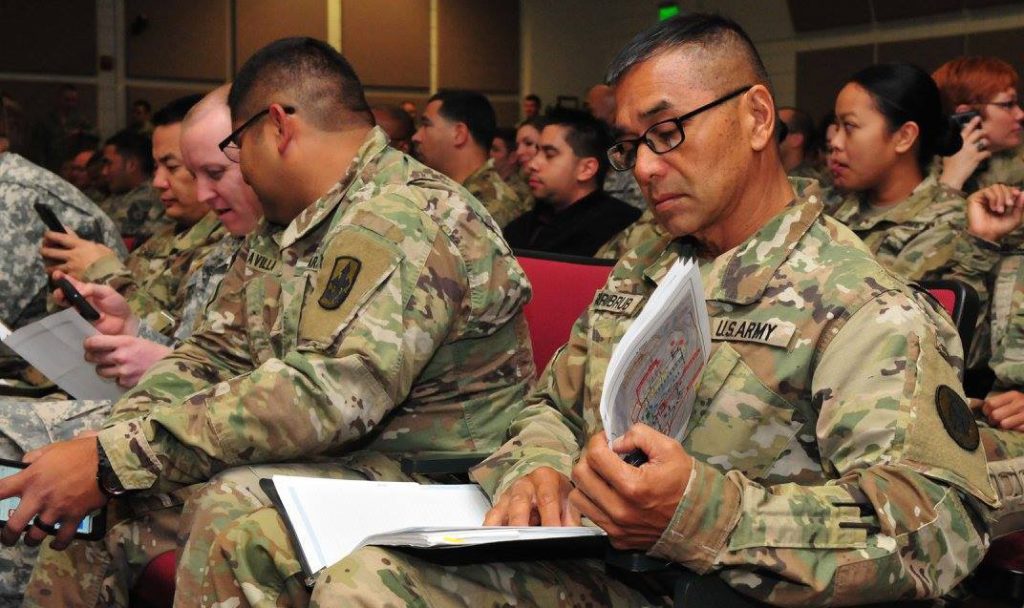 Chief Warrant Officer Edwin Parubrub, with the Hawaii Army National Guard Defensive Cyberspace Operations-Elements, waits for the introductory brief of Cyber Shield 17 to begin at Camp Williams, April 24, 2017. Cyber Shield 17 is an Army National Guard Defensive Cyberspace Operations exercise, with participation of approximately 800 members of the Air National Guard, United States Army Reserve, state and federal government agencies, industry partners, and academia. Photo by Sgt. Michael Giles