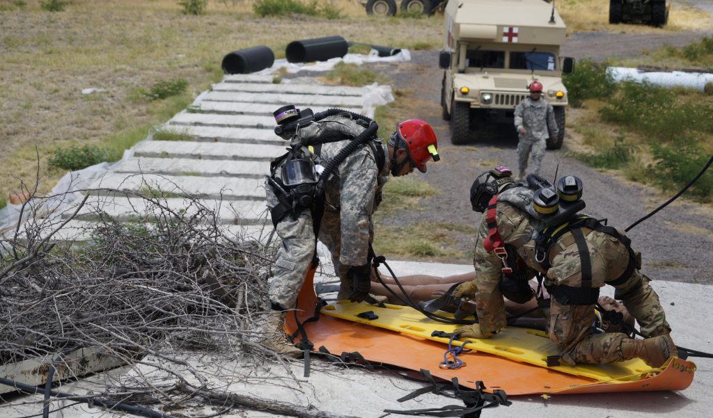 Soldiers with Hawaii National Guard’s rope rescue team package a victim in preparation for a high angle rescue during the Combined Training Exercise at Kalaeloa, Hawaii, July 17, 2017. A Combined Training Exercise is biannual training event that affords CERFP team members opportunities to grow in their disaster response skills. (Air National Guard Photo by Tech. Sgt. Andrew Jackson)