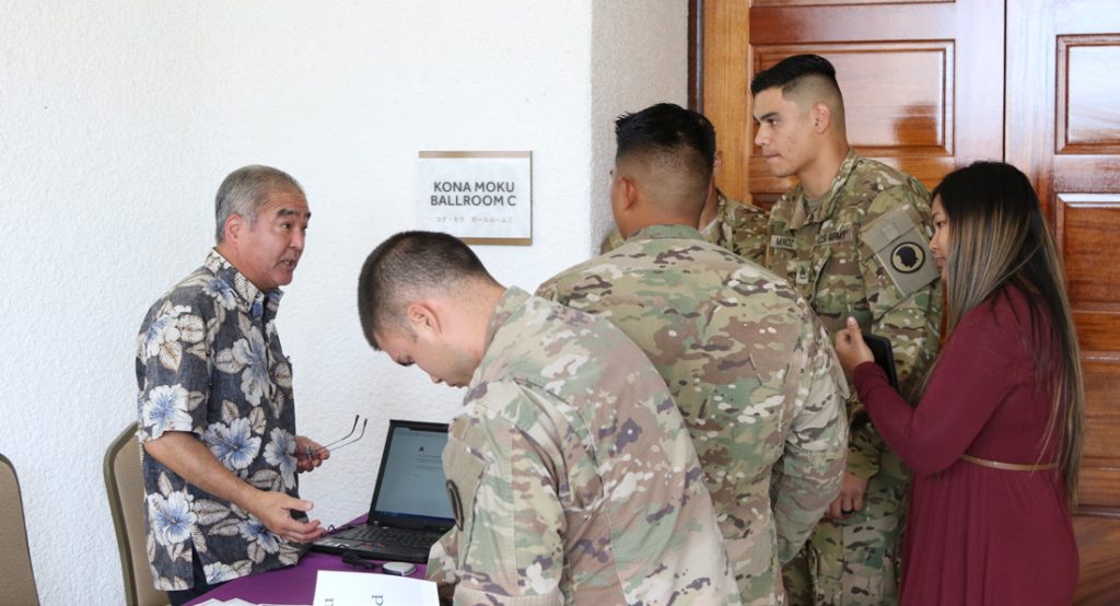 Tim Fujino, Transition Assistance Advisor of the Veterans Retraining Assistance Program, helps Soldiers from Bravo Company, 777th Aviation Support Battalion with questions they have regarding transition assistance during the Yellow Ribbon Reintegration Program June 25, 2017. The Yellow Ribbon Reintegration Program’s purpose is to help Soldiers adjust to returning from overseas. (U.S. Hawaii Army National Guard photo by Pfc. Chavaughn Washington)