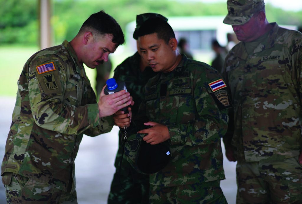 Lt. Dustin D. McCormick, 10th Civil Support Team, Survey Team Leader demonstrates a the operation of an radiation detector for military members from Thailand and a 25th Infantry Division Solider during a recent joint Chemical Biological Radiological Nuclear (CBRN) exchange at the Hawaii Army National Guard’s Regional Training Institute in Waimanalo. March 22, 2018. (U.S. National Guard Photo By Tech. Sgt. Andrew Jackson)