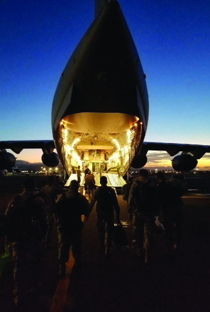 Airmen from the 154th Medical Group, Detachment 1, board a C-17 Globemaster III assigned to the 204th Airlift Squadron, Joint Base Pearl Harbor-Hickam, Jan. 26, 2018. The medical airmen were headed to Nevada to facilitate a FEMA Region 9 field training exercise with partners from the California and Nevada Air National Guard. (U.S. Air National Guard photo by Capt. Sanders Sandoval)