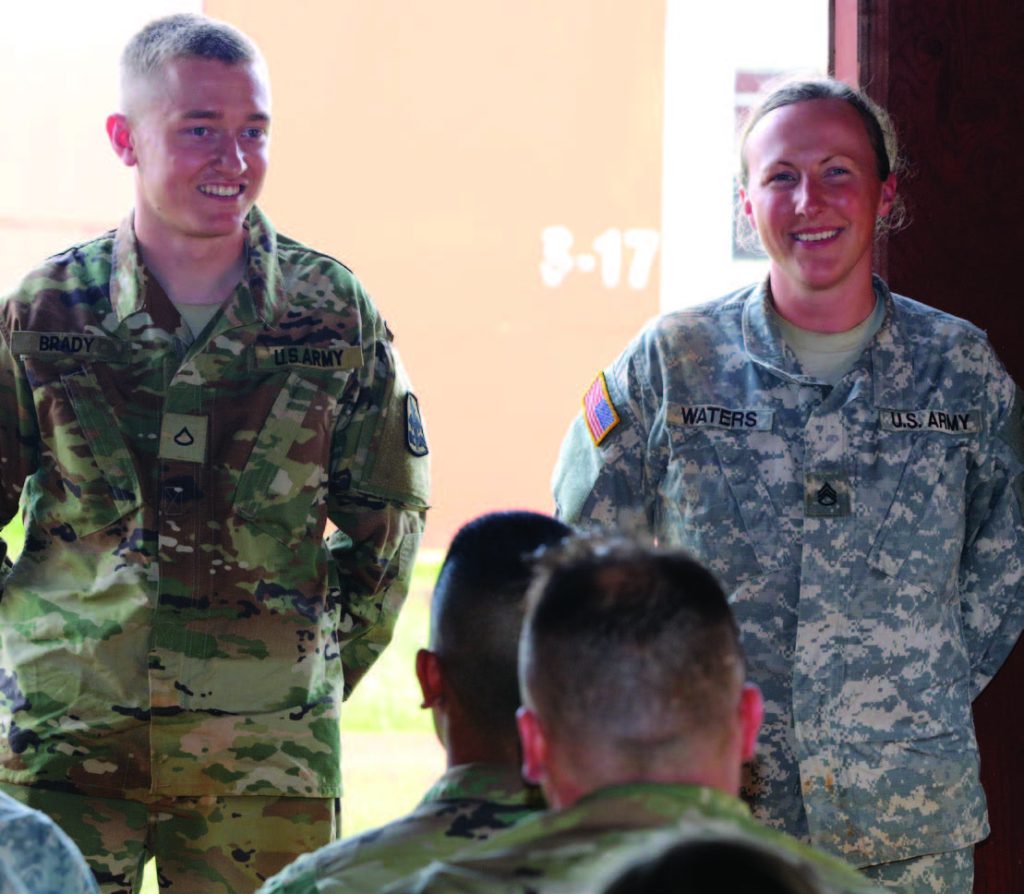 Hawaii Army National Guard Pfc. William I. Brady of 3rd Platoon, Alpha Troop, 1st Squadron, 299 Cavalry Regiment and Staff Sgt. Krysta M. Waters of the 111th Army Band are announced as the Enlisted and NCO winners of the Best Warrior Competition at Schofield Barracks, Hawaii, March 4, 2018. (U.S. Army National Guard photo by Spc. Matthew A. Foster/ Released)