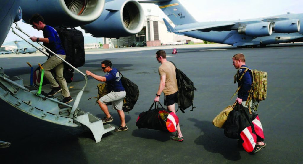 New York Air National Guard Airmen from the 103rd Rescue Squadron, board a C-17, March 4, 2018, at Joint Base Pearl Harbor-Hickam, Hawaii. The New York Airmen teamed up with members of Hawaii Air National Guard’s 204th Airlift Squadron to practice their search and rescue capabilities in a scenario entailing the recovery of fallen NASA astronauts. (U.S. Air National Guard photo by Senior Airman John Linzmeier)
