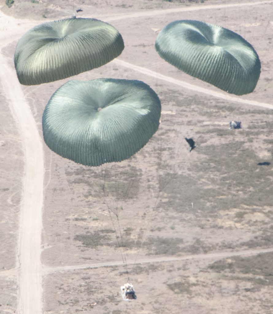 Pallets of equipment are airdropped from a C-17 Globemaster III during exercise Swift Response 18 on June 8, 2018, above Miroslawiec Air Base, Poland. (U.S. Air National Guard photo by Senior Airman John Linzmeier)