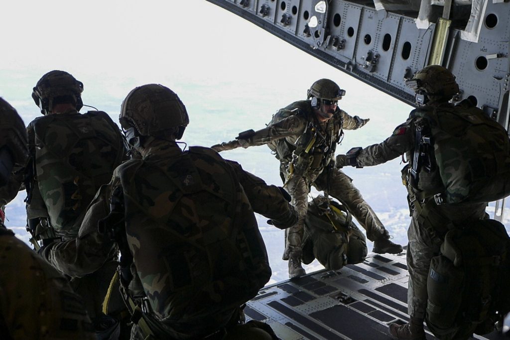 Members of the Italian Army 186th Airborne Regiment Forlgore Brigade execute a high altitude low opening jump alongside Portuguese Army Rapid Reaction Pathfinders as part of annual exercise Swift Response 18, June 6, 2018, over Latvia. (U.S. Air National Guard photo by Senior Airman John Linzmeier)