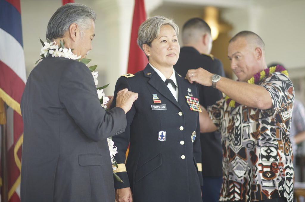 BG Suzanne P. Vares-Lum was promoted to major general in a ceremony held at Washington Place. Attending the ceremony was her family and friends, her current and retired military coworkers from the Guard and active duty. BG Kenneth Hara provided comments as the MG Arthur “Joe” Logan was off island. She was pinned by Governor David Ige and her husband LTC (Ret) Courtney Vares-Lum. MG (Ret) Gary Hara administered the Oath of Office. (U.S. Air National Guard Photo By Tech. Sgt. Andrew Jackson)