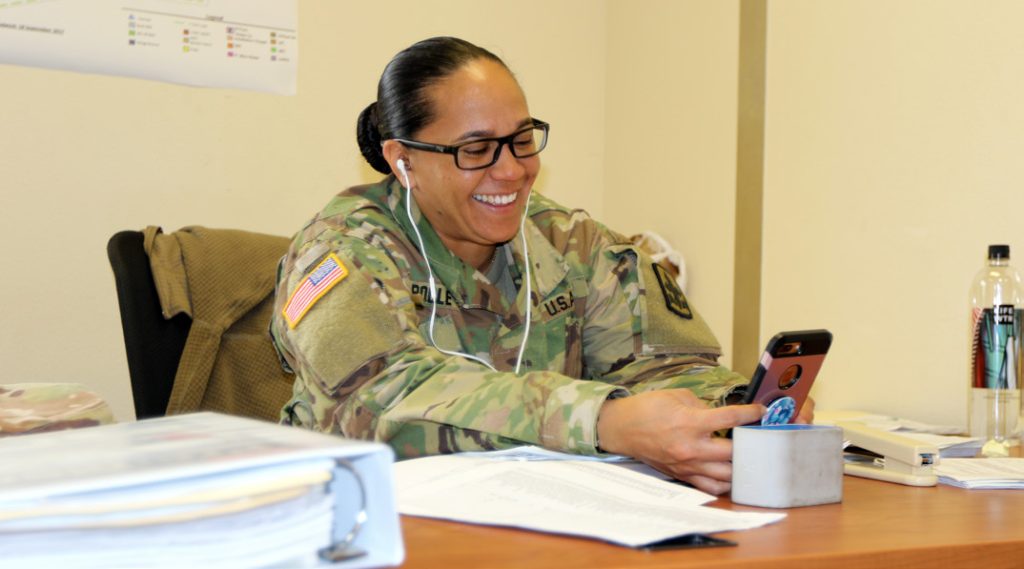 Spc. Janis K. Poole, a human resource specialist with the 29th Infantry Brigade Combat Team, takes a break to Face Time her two children back home in Hawaii on Oct. 8, 2018, at Camp McGregor, New Mexico. Poole prepares to deploy to Kosovo in support of Multinational Battle Group East Kosovo Forces (KFOR). (Hawaii Army National Guard Photo by Sgt. Tinisha Mellein-Fortson)