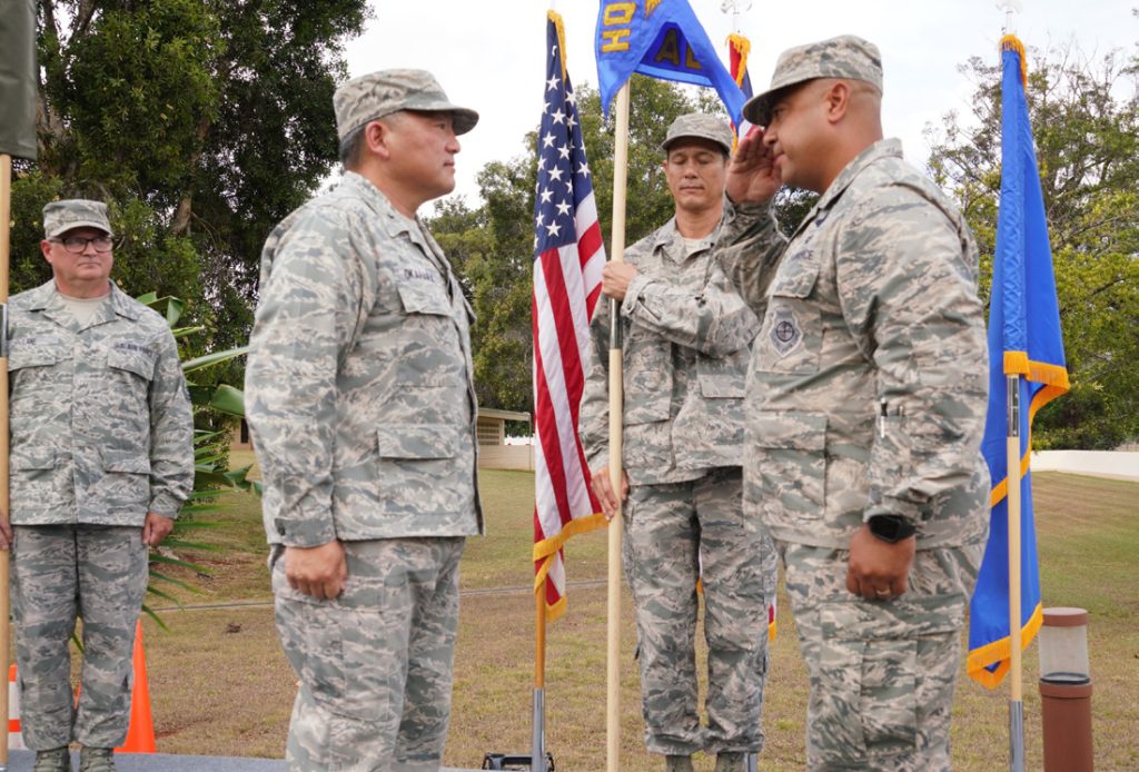 Col. Phillip Mallory, commander, 298th Air Defense Group salutes Brig. Gen. Ryan Okahara, commander, Hawaii Air National Guard as He accepts command of the newly formed 298th Air Defense Group during its activation ceremony, Wheeler Army Air Field, August 03, 2019. (U.S. Air National Guard Photo by Tech. Sgt. Andrew Jackson)