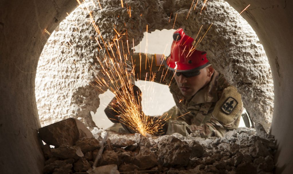 Hawaii Army National Guard Spc. Tyson Ortiz breaks through concrete and reinforced steel as part of the Combined - Multinational Task Force (CTF 501) search and extraction training scenario on July 18, 2019 at Kalaeloa Urban Search and Rescue Training area, Hawaii. Service members from the Philippines, Indonesia, Bangladesh, Vietnam, Oregon Air National Guard, traveled to Hawaii as part of a State Partnership Program training event. (U.S. Air National Guard photo by Master Sgt. Mysti Bicoy)