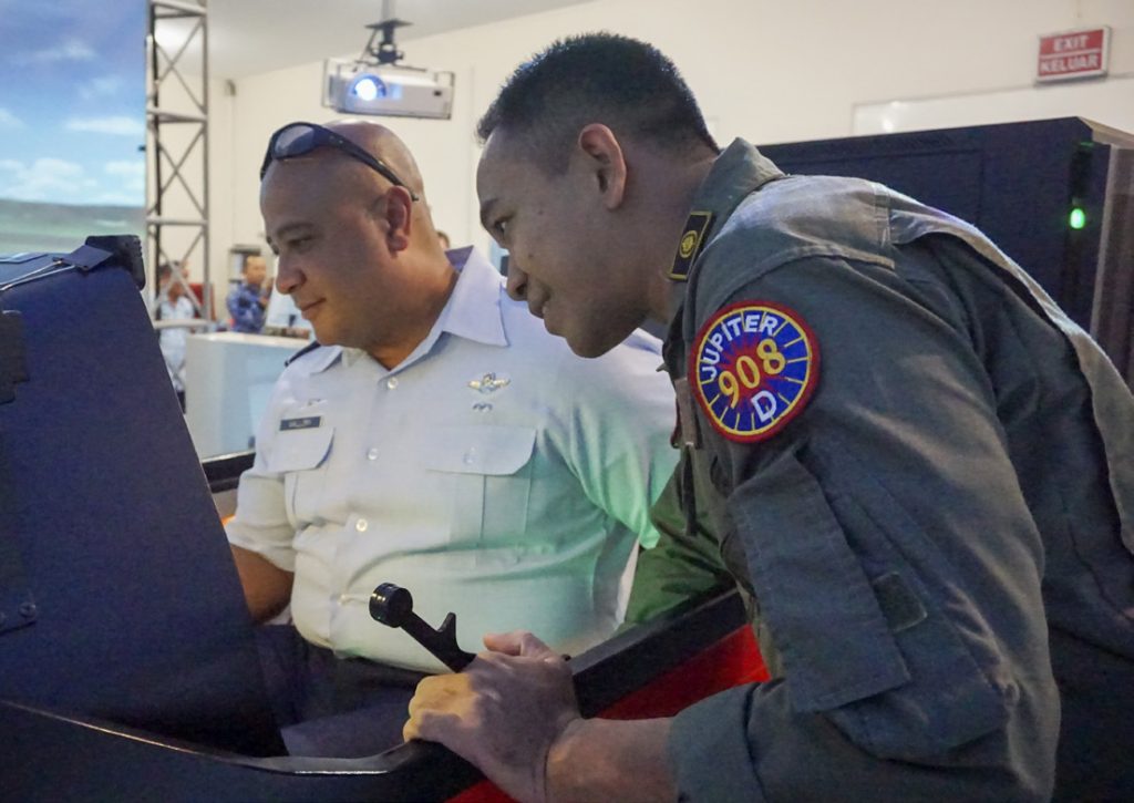 Hawaii Air National Guardsman (HIANG) Colonel Phillip L. Mallory, commander, 298th Air Defense Group (ADG), speaks with a TNI pilot during a tour of the Indonesian Air Force (TNI) Air Training Wing Jul. 10, 2019 in Yogjakarta, Indonesia. (U.S. Air National Guard photo by Tech. Sgt. Alison Bruce-Maldonado)