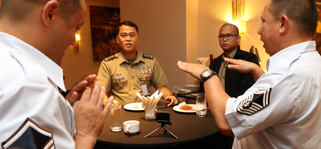 Hawaii Air National Guard Senior Master Sgt. Michael Zheng, Intelligence Analyst from the 201st Intelligence Squadron, shares some disaster response experiences with Philippine Army Capt. Rene Datugan, during an Incident Awareness and Assessment (IAA) Subject Matter Expert Exchange (SMEE) conference in Makati on July 16, 2019. The SMEE conference creates opportunities to enhance international relationships through the exchange of operational knowledge during disaster response and emergency crisis management. (U.S. Air National Guard photo by Senior Airman Robert Cabuco)