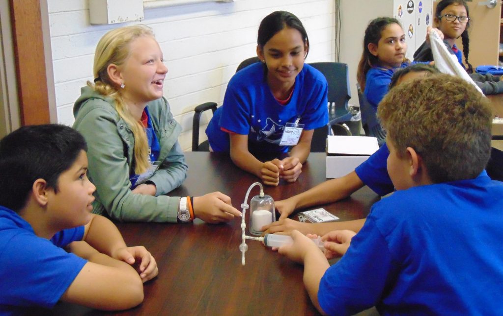 STARBASE Showcase, Pāhoa, HI. 5th grade students from Pāhoa Elementary explore fluid mechanics with a marshmallow and a bell jar at STARBASE. (Photo by: Kelly McVinnie)