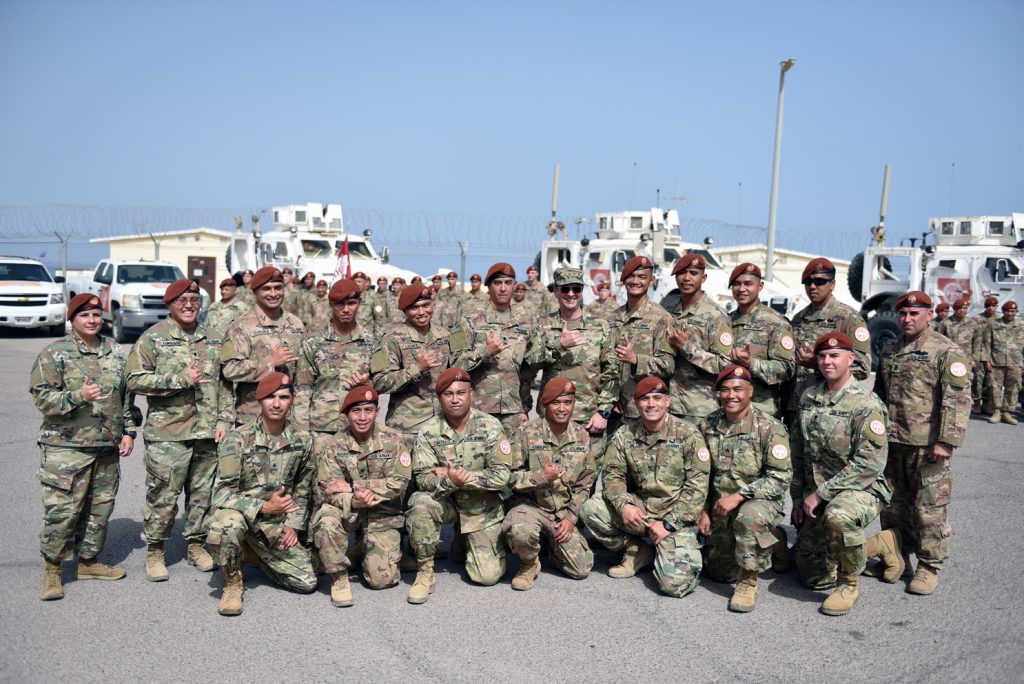 Air Force Gen. Joseph Lengyel, chief National Guard Bureau, and Hawaii National Guard troops, give the shaka sign after the general reenlisted the soldiers during a visit to the Multinational Force and Observers, the Sinai Peninsula, Egypt, May 1, 2019. (U.S. Army National Guard photo by Sgt. 1st Class Jim Greenhill)