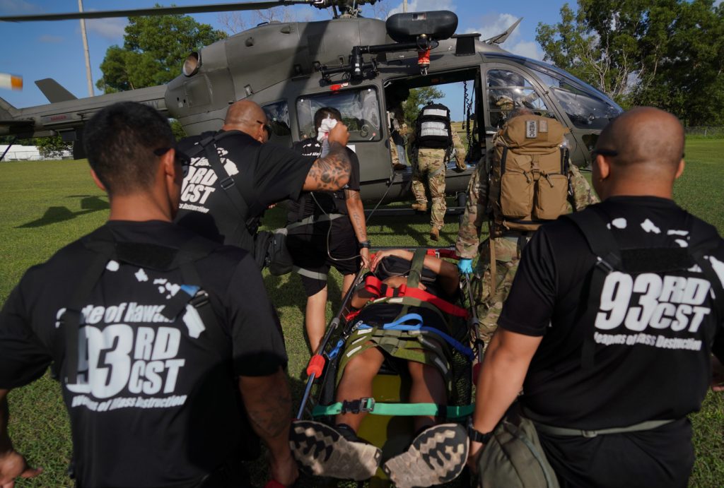Members of the 93rd CST load an Airman with a simulated injury on a Guam National Guard Lakota helicopter for transport during exercise Vigilant Guard 2020, Guam, Nov. 21, 2019. Vigilant Guard is a series of exercises that take place in each FEMA (Federal Emergency Management Agency) region annually. The training exercise program sponsored by U.S. Northern Command (USNORTHCOM), in conjunction with National Guard Bureau, provides civilian-military first responders and emergency management personnel the opportunity to evaluate their capabilities and identify areas for improvement, in the most realistic, large-scale disaster scenarios possible. (U.S. Air National Guard photo by Tech. Sgt. Andrew Jackson)