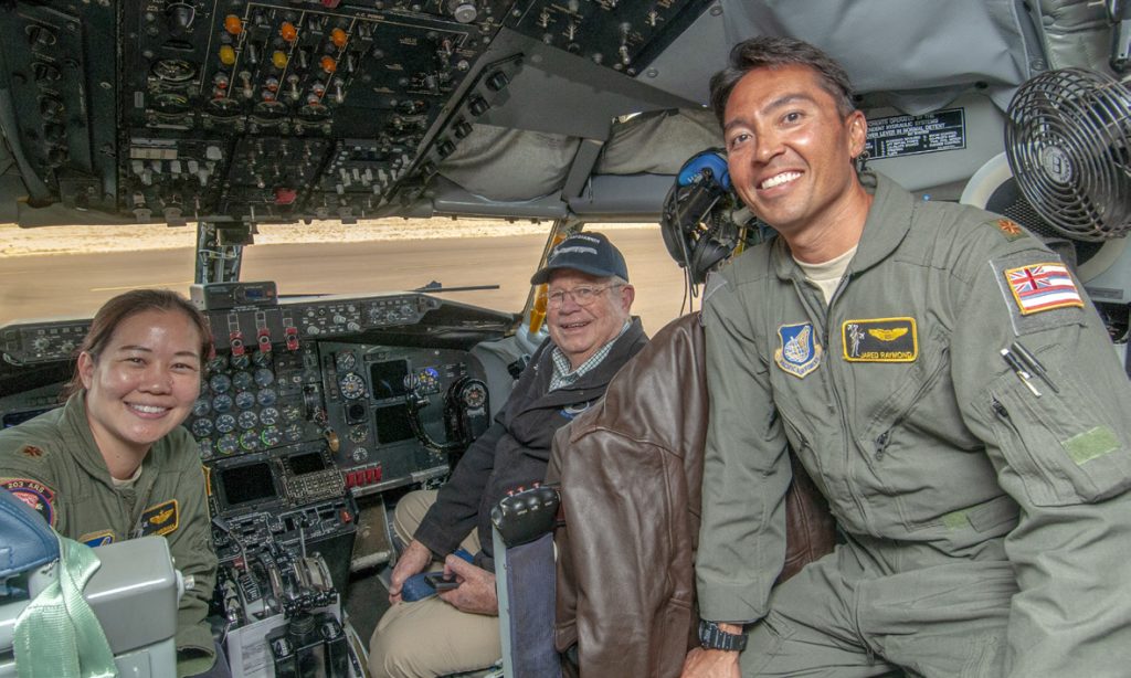 Maj. Carrie Hironaka, 203rd Air Refueling Squadron pilot, retired Lt. Col. Richard Trail and Maj. Jared Raymond pose for a picture in the flight-deck of KC-135 Stratotanker, tail number 60-0329, Oct. 2, 2019, Colorado Springs, CO. Trail was a crew member operating 60-0329 during a 1967 mission that accomplished the first ever tri-plane refueling and earning the crew the 1967 Mackay Trophy awarded by the U.S. Air Force for the most meritorious flight of the year. (U.S. Air National Guard photo by Senior Airman Orlando Corpuz)