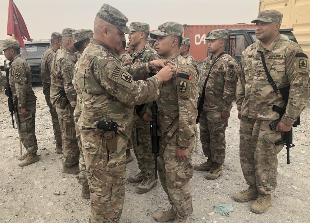 Sixty Hawaii Army National Guardsmen receive the Combat Action Badge.